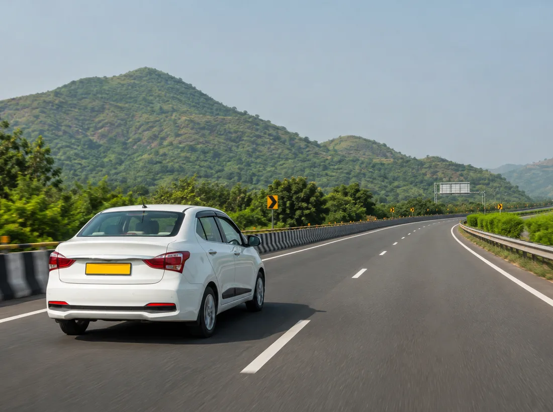 Sedan on a scenic road for an outstation journey